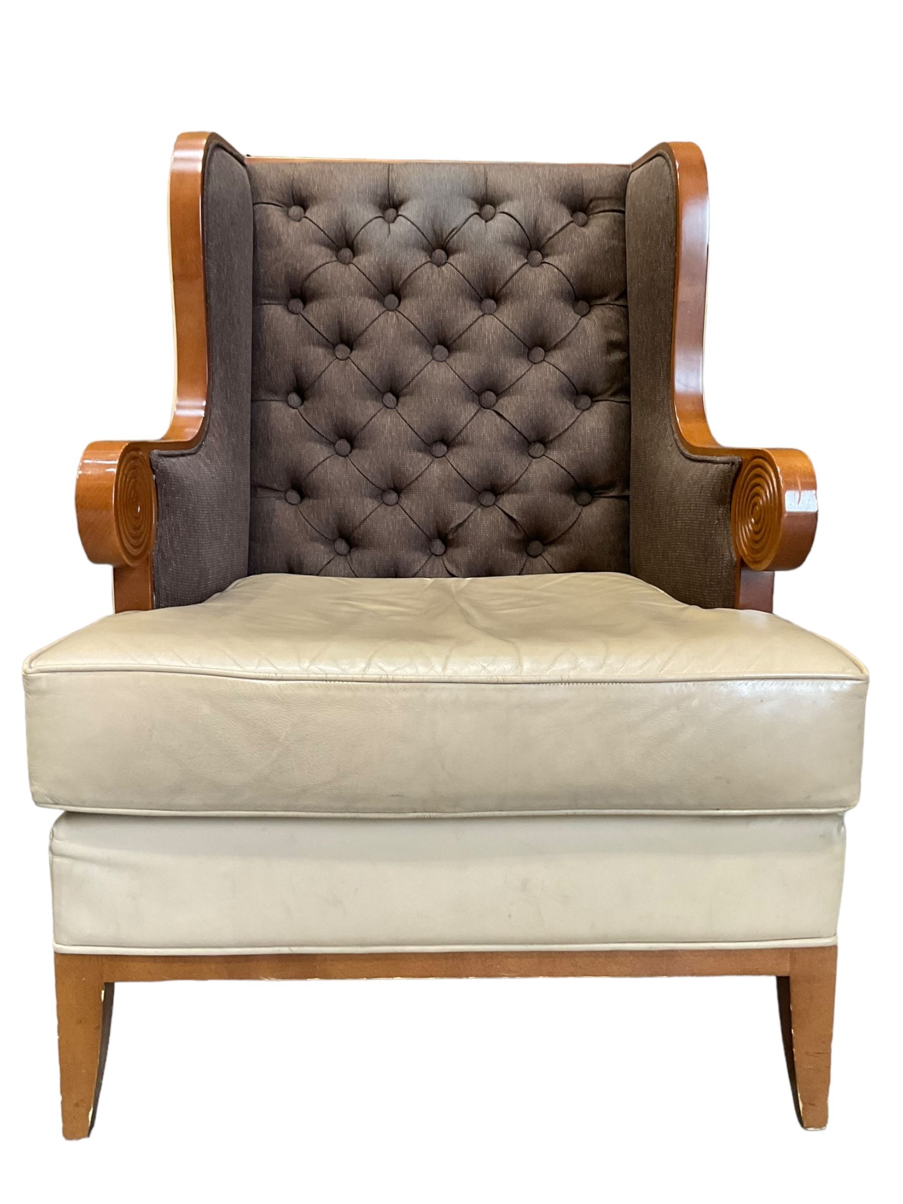 Walnut finish framed wing back armchair upholstered leather and buttoned fabric