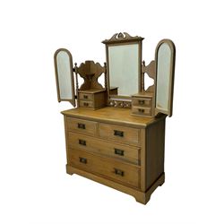 Late Victorian satin walnut dressing table, central mirror with carved crest flanked by two adjustable side mirrors, each supported by turned uprights, the base fitted with two short over two long drawers with brass handles, resting on bracket feet