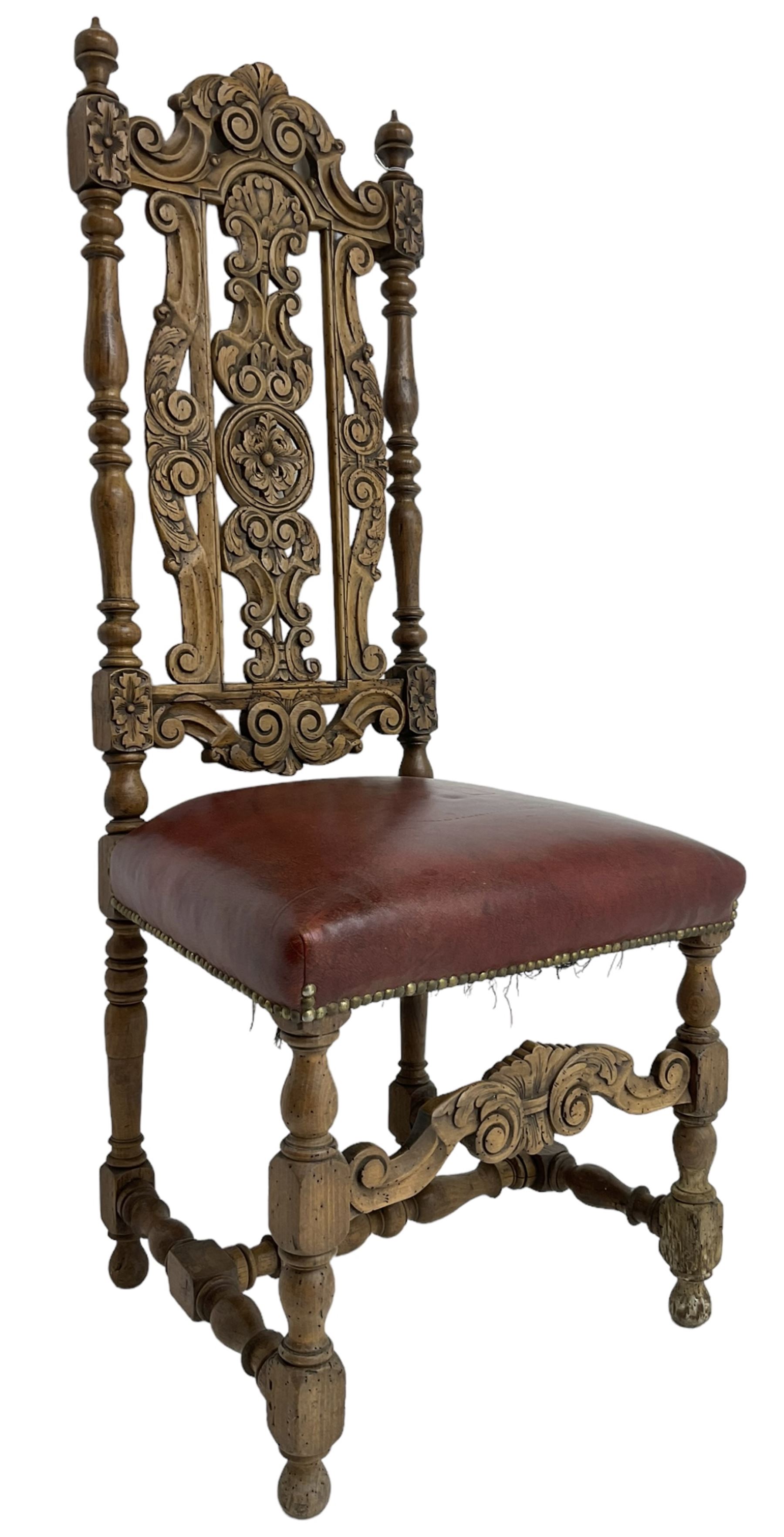 Carolean design oak high-back chair, the cresting rail carved with S-scrolls and foliage, the splat with a central flower head decorated with extending scrolls and acanthus leaves, upholstered seat, on turned and block supports united by S-scroll carved middle rail and turned stretchers