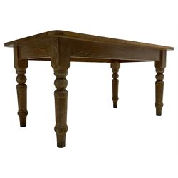 Limed oak dining table, rectangular top with rounded corners, on turned supports