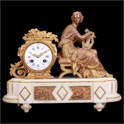 French - late 19th century 8-day figural mantle clock c 1880, with a breakfront alabaster plinth raised on four conforming feet, with two recessed and three raised lozenge panels, continuous bead decoration and a cast gilt figure of a seated female playing a Lyre,  Parisian drum movement with an enamel dial and Roman numerals, five-minute Arabic's and gilt Louis XVI hands, twin train countwheel striking movement, striking the hours and half-hours on a bell. With Pendulum. 