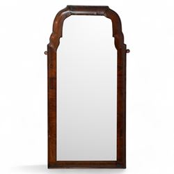 George II walnut cushion framed wall mirror, moulded frame with shaped upper corners, beve...