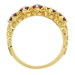 18ct gold five stone oval cut glass-filled ruby ring, with scroll design shoulders, London 2005