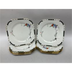 Art deco Shelley tea service for eight, decorated with floral sprigs, comprising teacup and saucers, dessert plates, two cake plates, milk jug and open sucrier, with to extra dessert plates