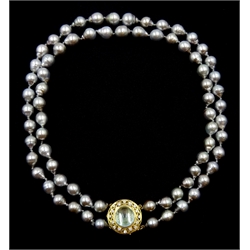 Double strand Tahitian pearl necklace, seventy-two cultured pearls, on a gold cabochon blue topaz and diamond openwork clasp stamped 18K 750