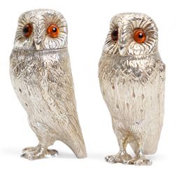 Pair of Elizabeth II silver owl salt and pepper casters with gilded interiors, the naturalistically cast bodies with glass eyes H7.5cm London 2006 Maker Comyns of London 