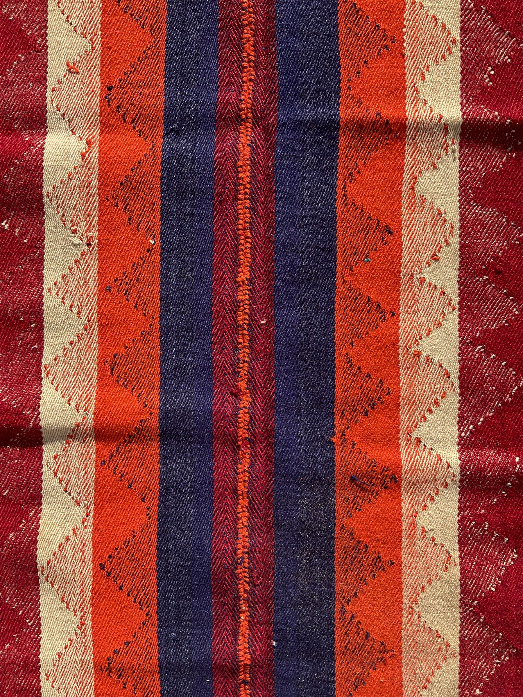 South West Persian Jajim Kilim ground rug, the field with alternating vertical stripes with lightly woven diamond-shaped motifs running through the pattern, the edges with small decorative tufts