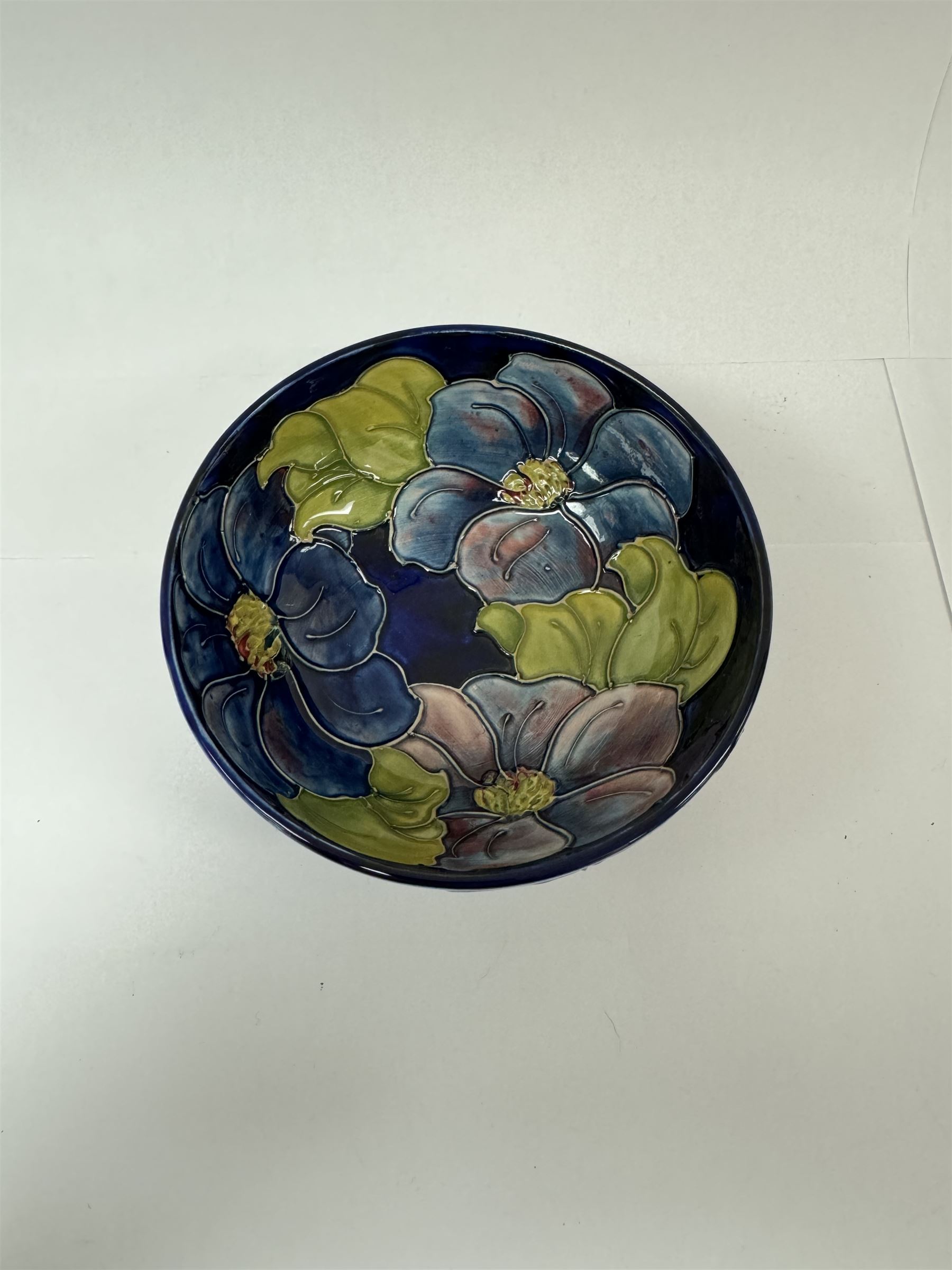 Moorcroft bowl in Clematis pattern, together with Moorcroft pedestal bowl in Anemone pattern both with makers mark below, pedestal dish H12cm 