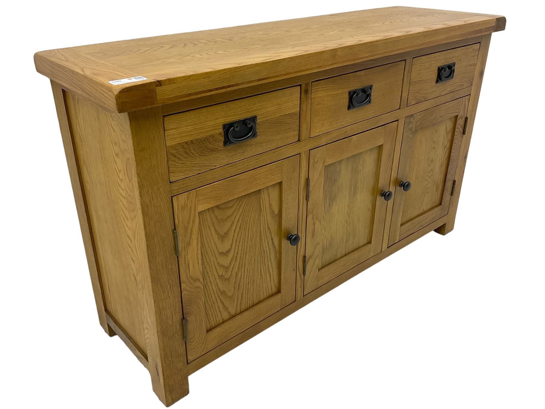 Contemporary light oak sideboard, fitted with three drawers over three panelled cupboards enclosing shelving, on square supports