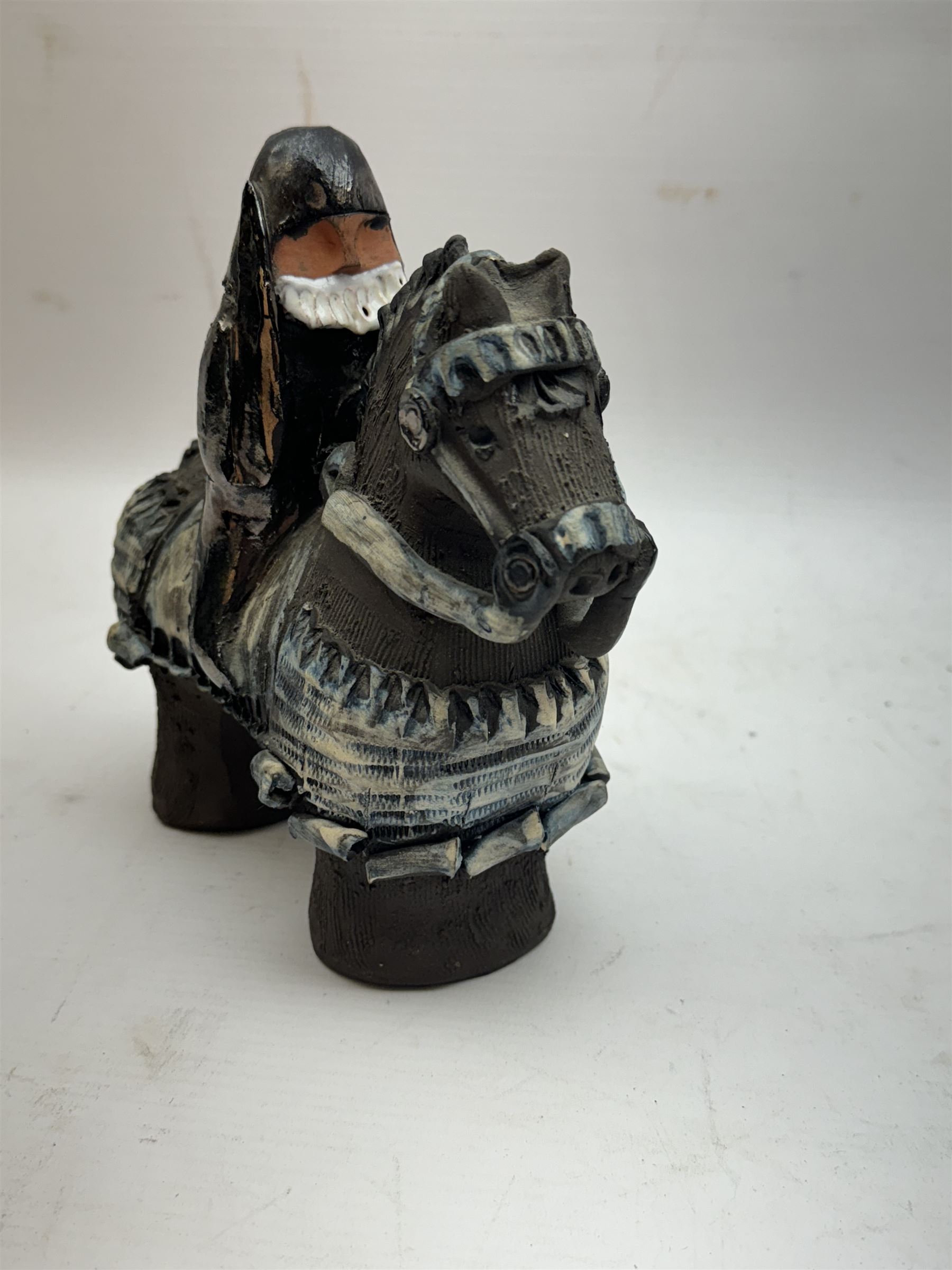 Studio pottery figure, modelled as a knight on horseback, H16cm