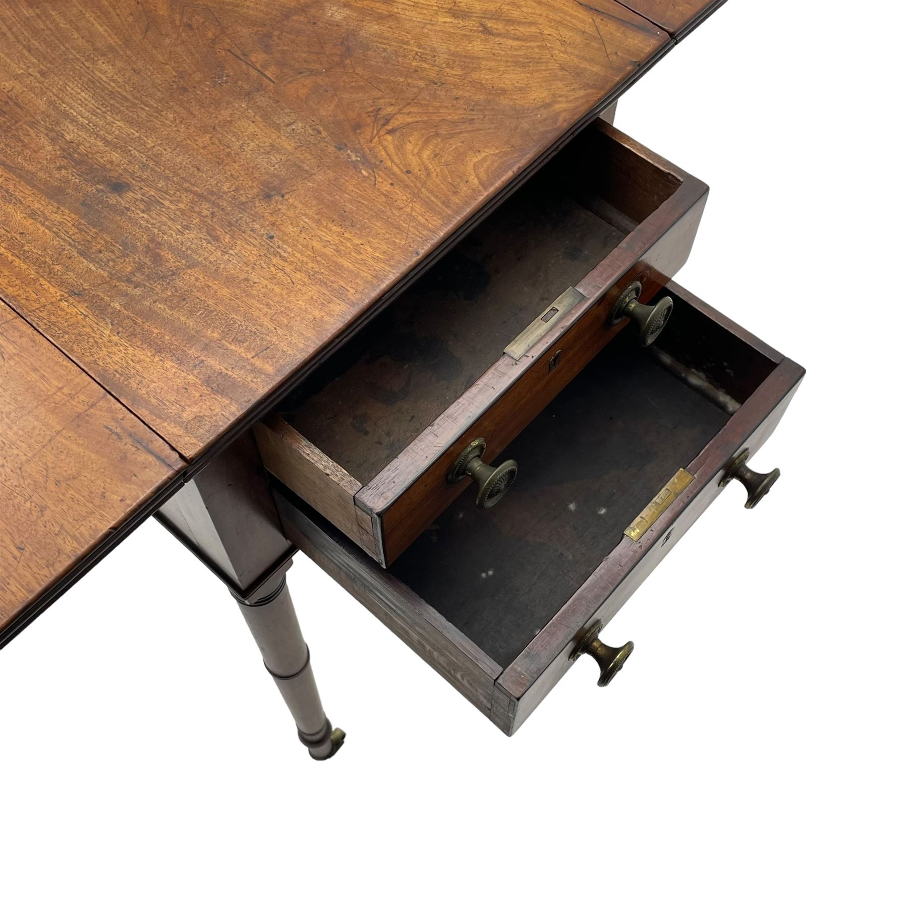 George III mahogany Pembroke table, reed moulded rectangular drop leaf top with rounded corners, fitted with two drawers opposing two false drawers, on ring turned supports with brass cups and castors 