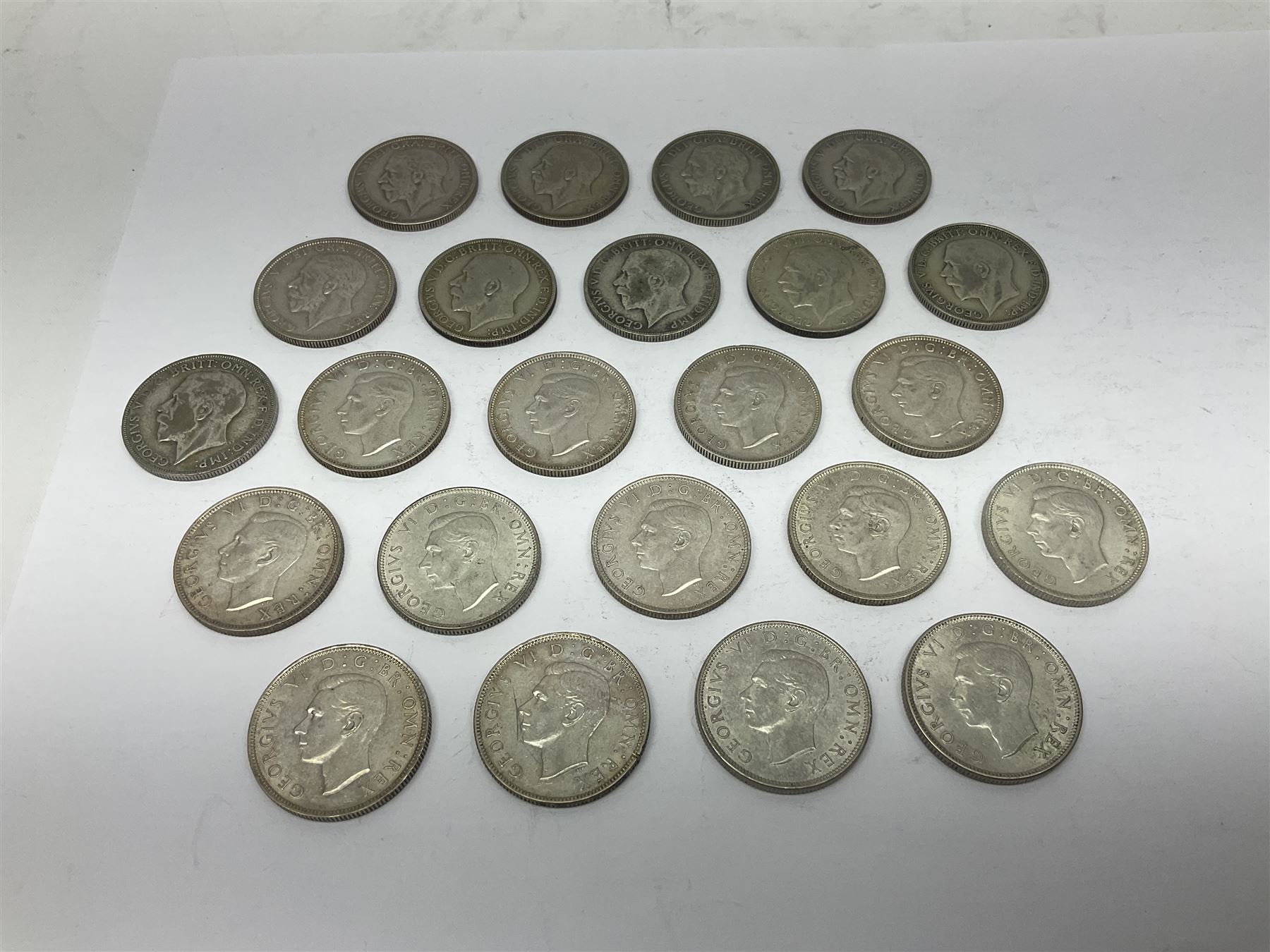 Approximately 260 grams of Great British pre 1947 silver two shillings coins 