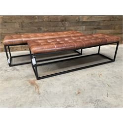 Two rectangular metal framed benches, upholstered in buttoned tan leather