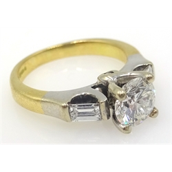 Diamond ring set with central diamond approx 0.7 carat with diamond beneath and baguette diamond shoulders hallmarked 18ct  