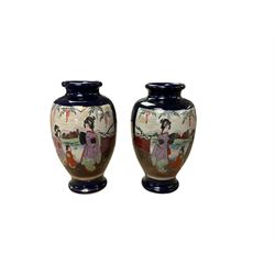 Pair of Japanese vases decorated with figures in a landscape, H38cm