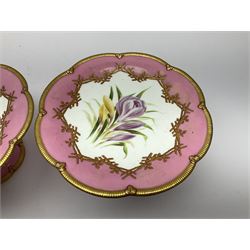 Victorian dessert service, comprising four comports and nine plates, each decorated with floral sprigs to the centre with a pink and gilt border, largest comport H13cm, plate D22.5cm