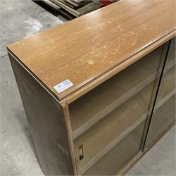 Mid-20th century oak library bookcase, sloped form and fitted with two sliding glass doors - THIS LOT IS TO BE COLLECTED BY APPOINTMENT FROM THE OLD BUFFER DEPOT, MELBOURNE PLACE, SOWERBY, THIRSK, YO7 1QY