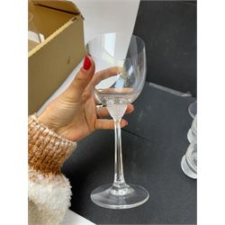 Twelve Villeroy & Boch Octavie glasses, to include six red wine glasses and six tumblers, each glass with hobnail cut decoration, together with a pair of Villeroy & Boch faceted glass candlesticks