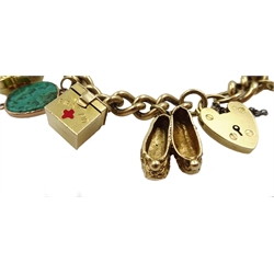 9ct gold curb bracelet with heart locket hallmarked,  with ten 9ct gold charms including stork carrying a baby, house, first aid box and an 18ct gold cross charm, all tested, hallmarked or stamped