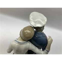 Lladro figure, Sailors Serenade, modelled as a sailor playing an accordion with a woman seated upon a crate, no 5276, year issued 1985, year retired 1988, H32cm