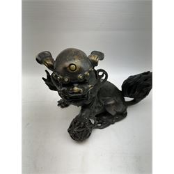 Bronze dog of foo, modelled with one paw placed upon ball, H18cm