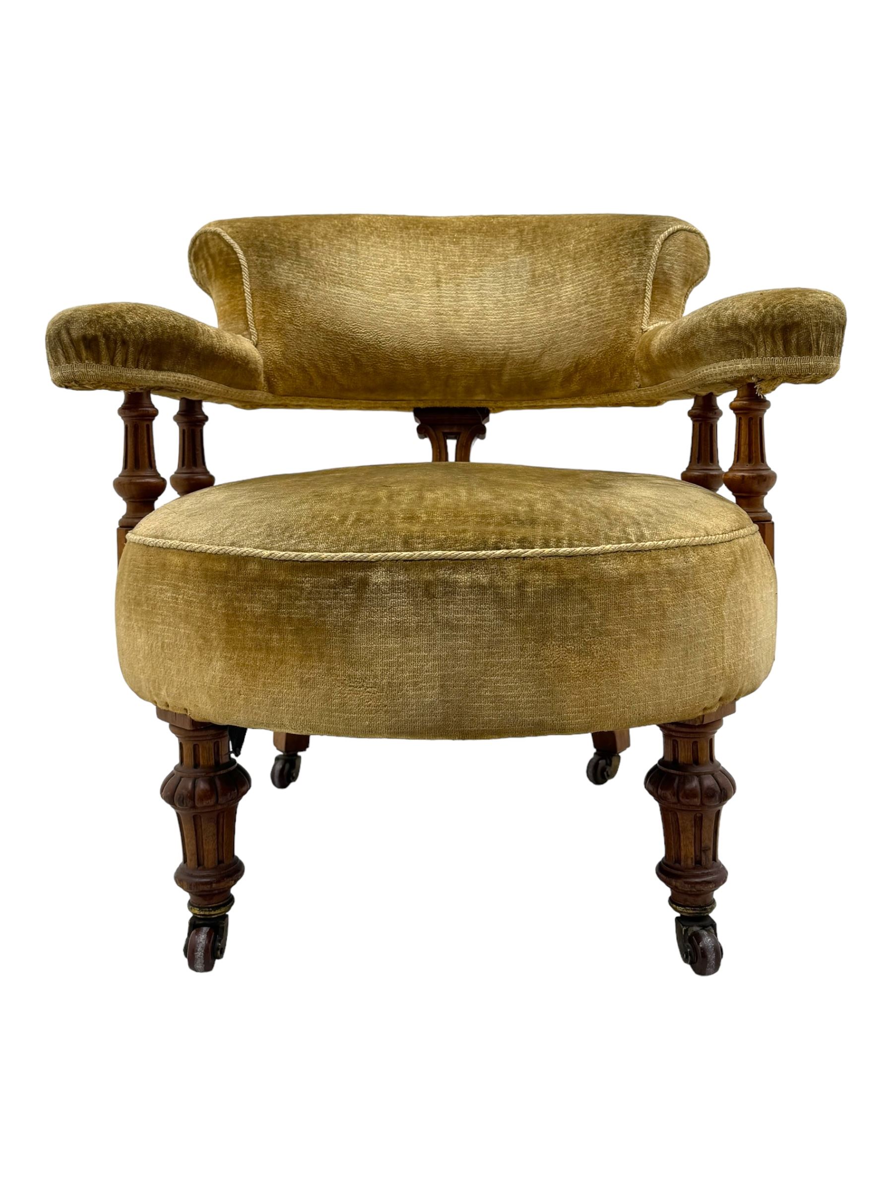 Victorian pair of mahogany armchairs, upholstered in gold velvet fabric, each with curved back, pierced splat and scroll arms, one with rounded seat and the other square, on turned front supports with castors