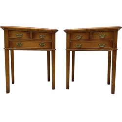Pair of yew wood lamp tables, each fitted with three drawers