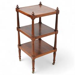 19th century mahogany three-tier what-not, rectangular top raised on ring-turned pilasters, terminating to brass castors