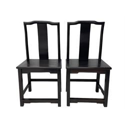 Pair of early 19th century Chinese Qing dynasty black wood side chairs, yoke cresting rail over shaped back panel, panelled rectangular seat on square supports united by stretchers 