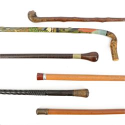 Collection of walking sticks, including a novelty example in the form of a walking stick 