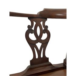 George III mahogany corner elbow chair, curved back rest and shaped arms with scroll carved terminals, on turned supports and pierced scroll carved interlaced splats, drop-in seat upholstered in brown leather, on square supports with inner chamfer and outer moulding 