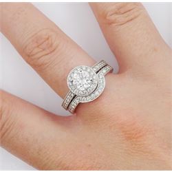 Platinum single stone round brilliant cut diamond ring, with pave set diamond surround, gallery and shoulders, principal diamond approx 0.90 carat, with platinum diamond set band, both hallmarked