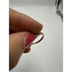 9ct gold wedding band, engraved with star decoration, together with a 9ct gold three stone garnet ring, both hallmarked 