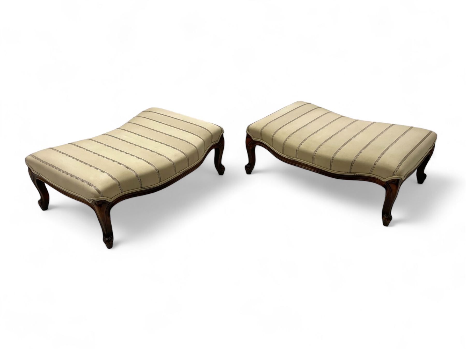 Pair of French design stained beech footstools, shaped form upholstered in pale fabric with herringbone stripe, on cabriole feet with scroll carved terminals 