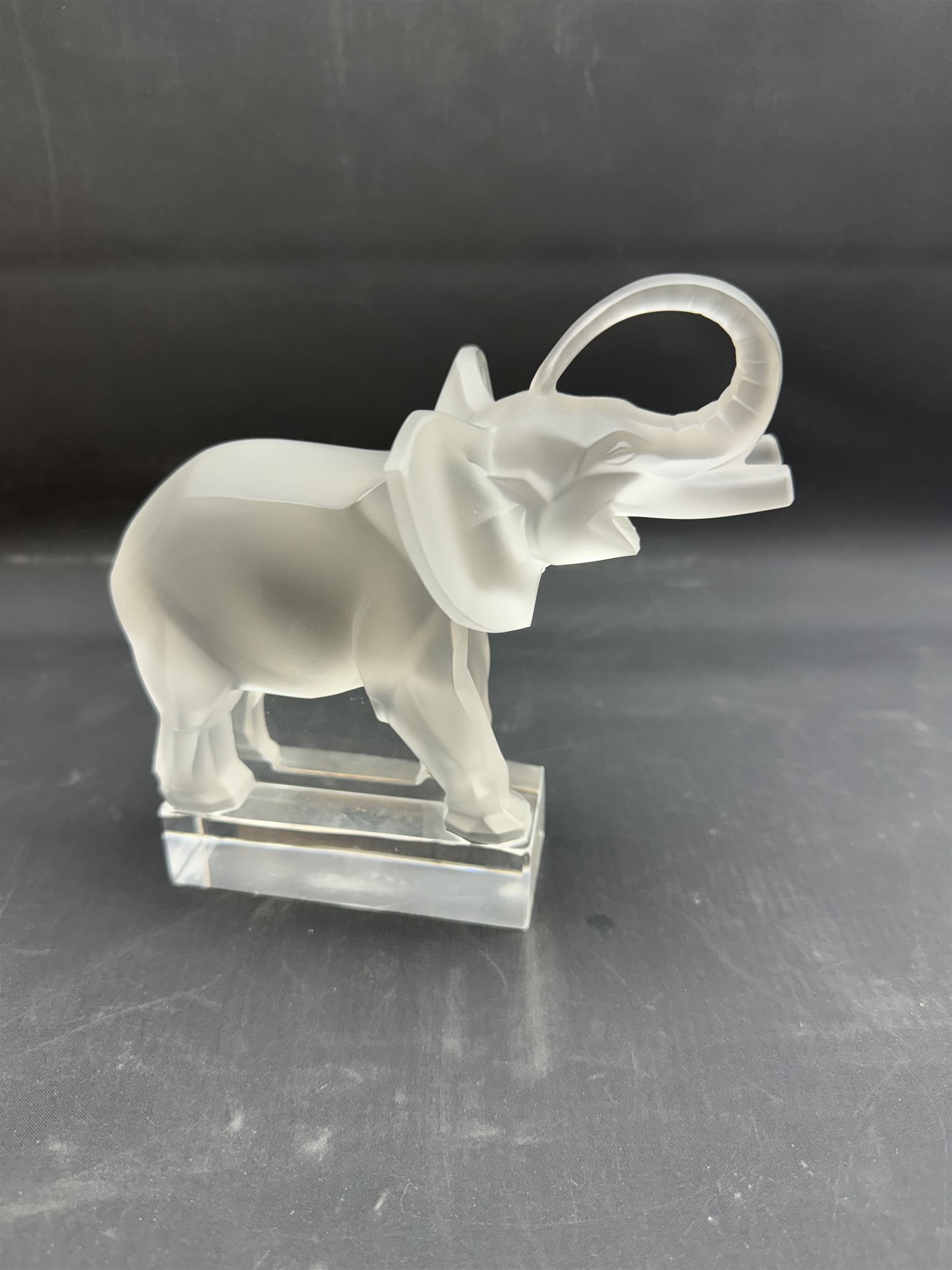 Lalique frosted glass model of an African Elephant, on clear rectangular plinth, engraved beneath Lalique France, H15.5cm