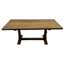 Rabbitman - oak dining table, rectangular adzed top, twin octagonal pillar supports on sledge feet, united by floor stretcher, carved with rabbit signature, by Peter Heap of Wetwang 