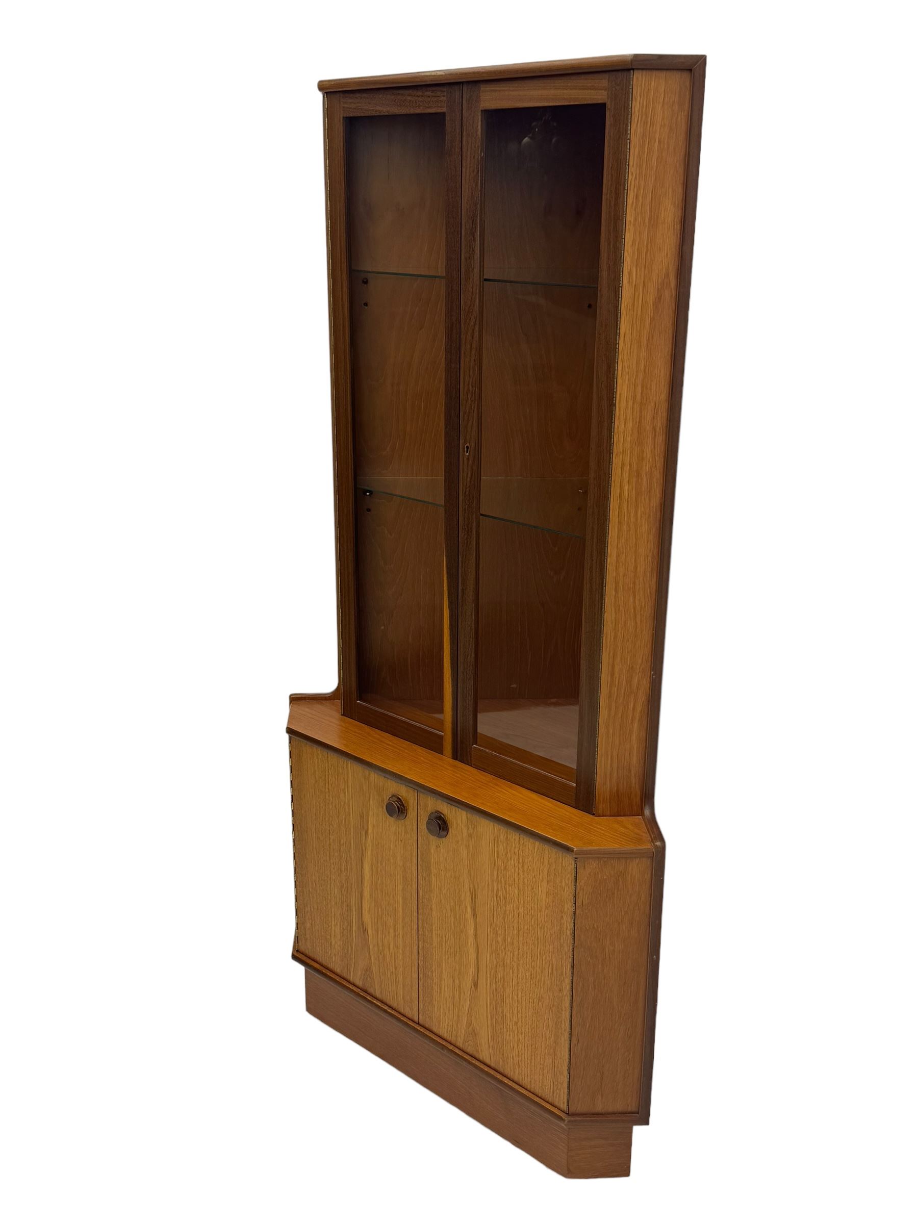 Nathan - teak corner display cabinet, double glazed doors enclosing two adjustable shelves over single cupboard.