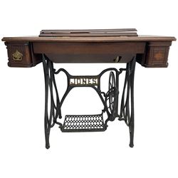 Early 20th century Jones treadle sewing machine table, bevel edged rectangular top with hinged lid enclosing sewing machine no. 480760, supported by cast iron treadle base