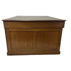 Late 19th century twin pedestal oak partner's desk, rectangular top with inset green leather writing surface, fitted with nine graduating drawers to each side, the rear drawers enclosed by panelled cupboards