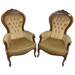 Pair of Victorian design stained beech armchairs, scroll and scallop carved cresting rail, upholstered in buttoned champagne fabric, on cabriole supports