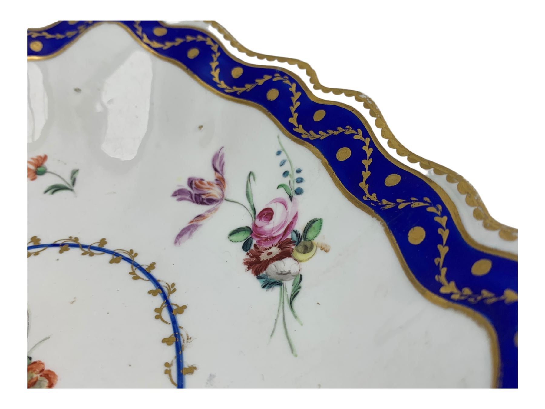 18th century Derby fluted lozenge shaped dish, in the manner of Edward Withers, painted with flower sprays within a blue and gilt leafy chain border, crown over D in blue, incised N, L26cm 