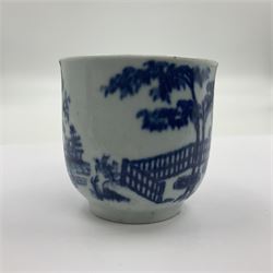 Two 18th century Worcester porcelain coffee cups, the first example decorated in the Plantation pattern, circa 1754, the second decorated in the Mansfield pattern, circa 1760, with workman's mark beneath, each approximately H5.5cm