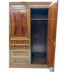 Edwardian inlaid mahogany combination wardrobe, projecting moulded cornice over figured frieze with satinwood banding, the central section fitted with cupboard over four long drawers, figured matched veneers and satinwood bands, flanked by two full height compartments enclosed by bevelled shield shaped mirror doors, satinwood fan inlaid spandrels, on moulded skirt base 