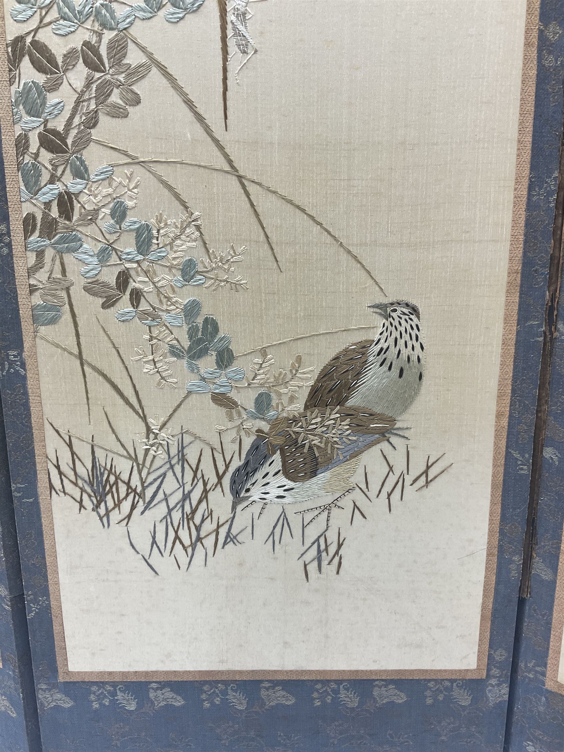 Two Oriental silk and wooden screens embroidered with birds and blossoming branches, largest H88cm 