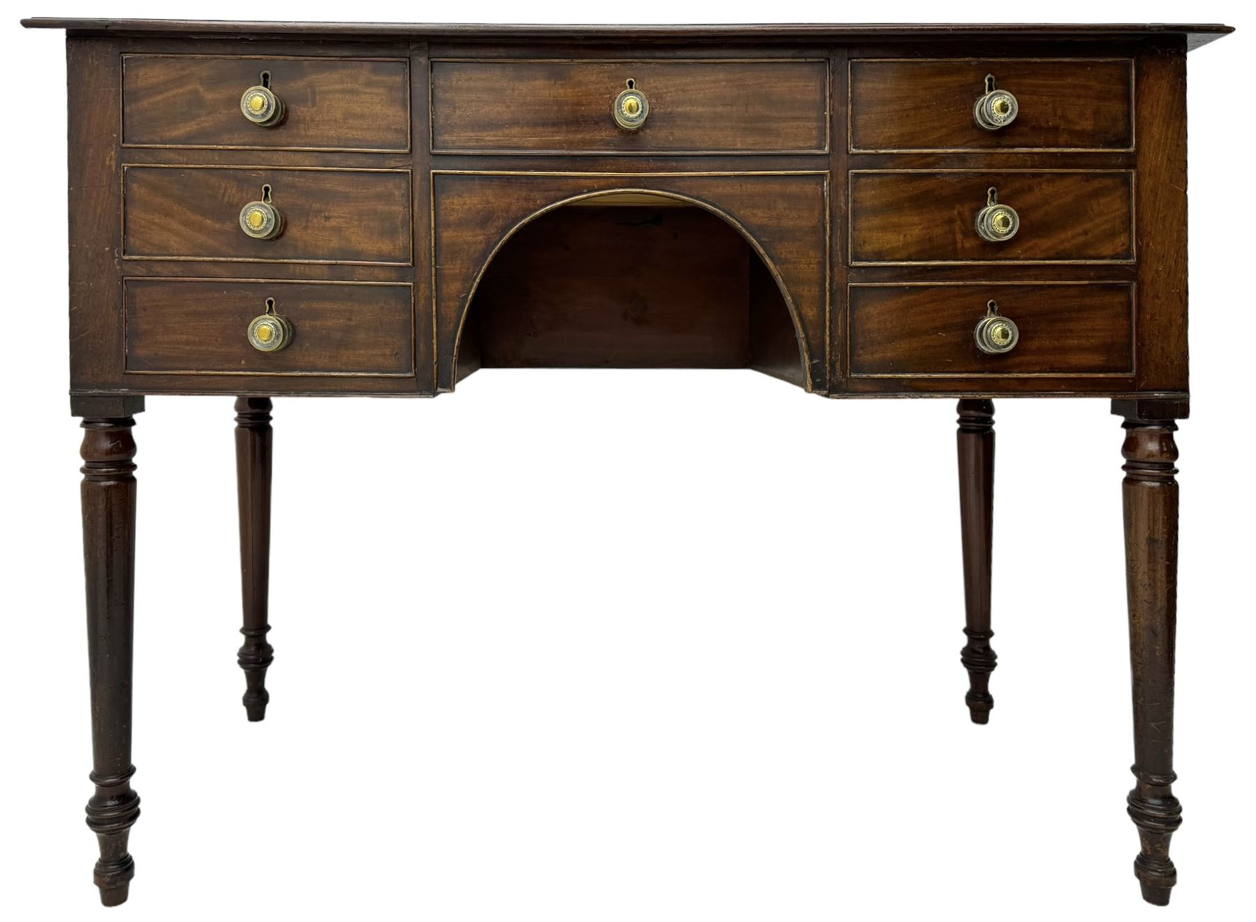 George III mahogany kneehole dressing or side table, moulded rectangular top over seven cock-beaded drawers, on ring turned support 