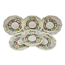 Six Dresden plates, with a pierced and fret border, with gilt rim and painted flower, with printed mark beneath, D18cm