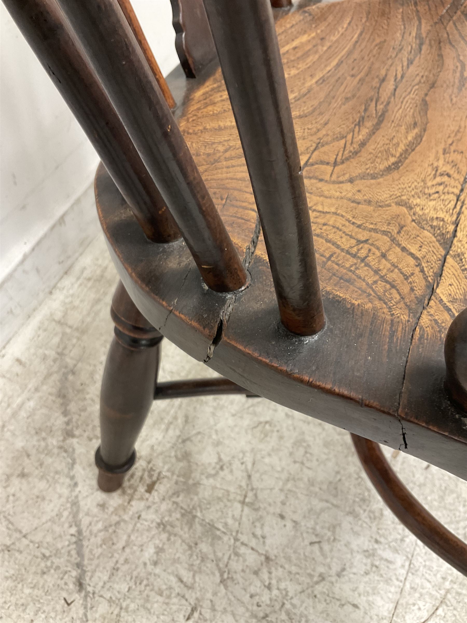 19th century yew wood and elm Windsor chair, low hoop stick back with pierced splat, dished seat raised on ring turned supports joined by crinoline stretcher