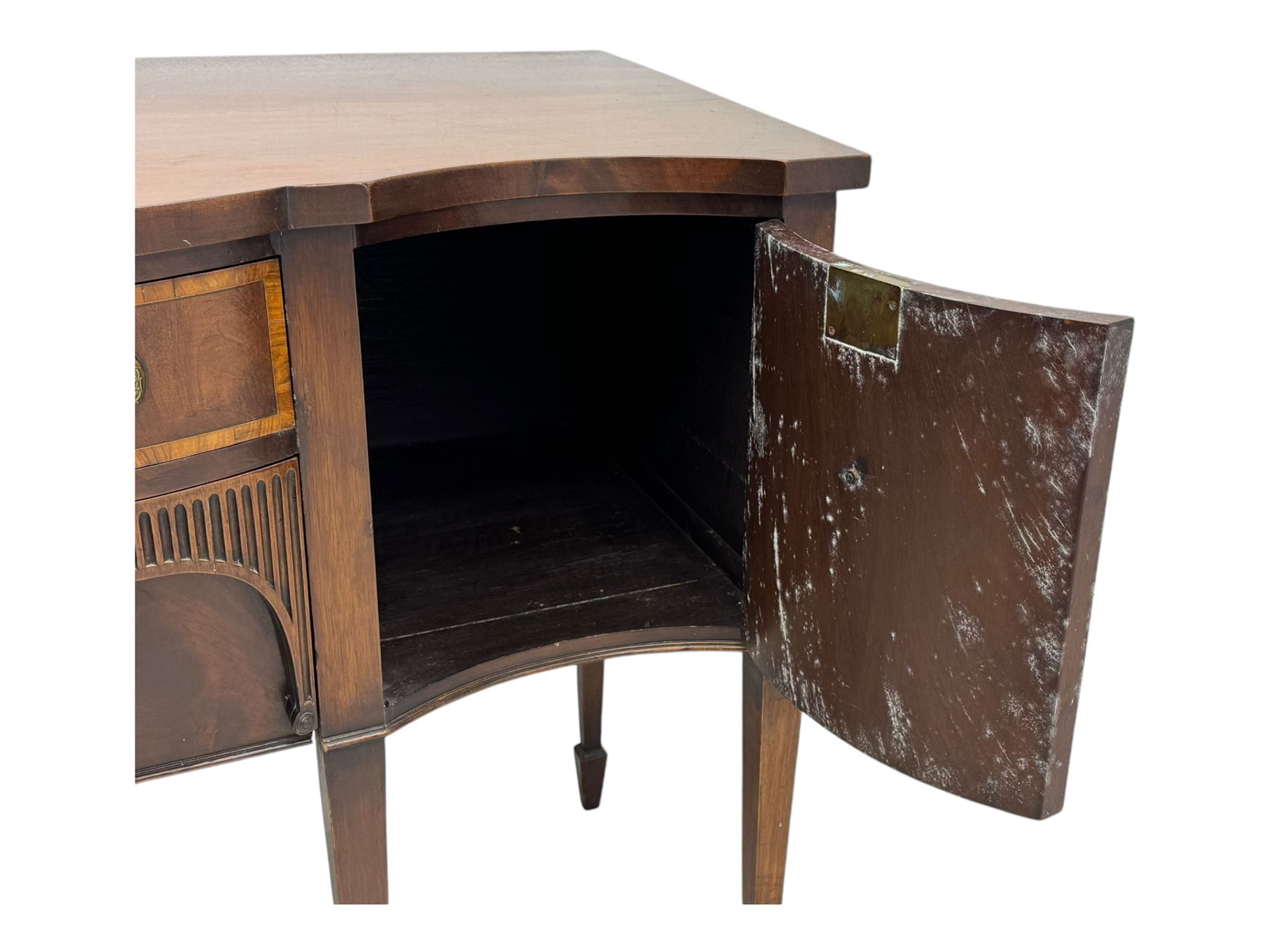 Early 19th century serpentine sideboard, fitted with two cupboards and two drawers, on square tapering supports with spade feet