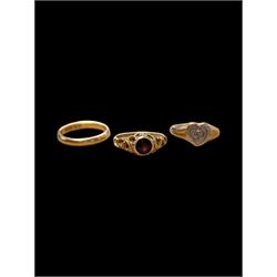 Three 9ct gold rings, including single stone garnet ring, heart shaped signet and plain wedding band