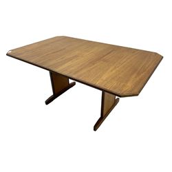 G-Plan -  1970s teak extending dining table, pull-out extending action with fold-out leaf, rectangular end supports on sledge feet united by stretcher (100cm x 160cm - 205cm, H73cm); set of six dining chairs, chevron-patterned backrests upholstered with floral patterned fabric, on tapered legs, H89cm